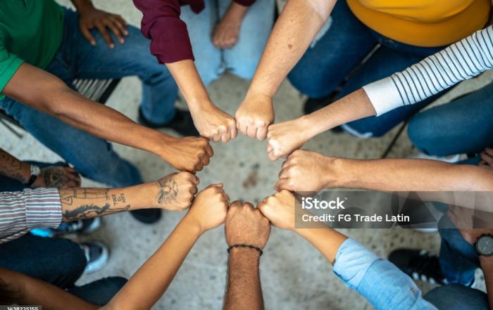 Close-up of a team doing fist bump